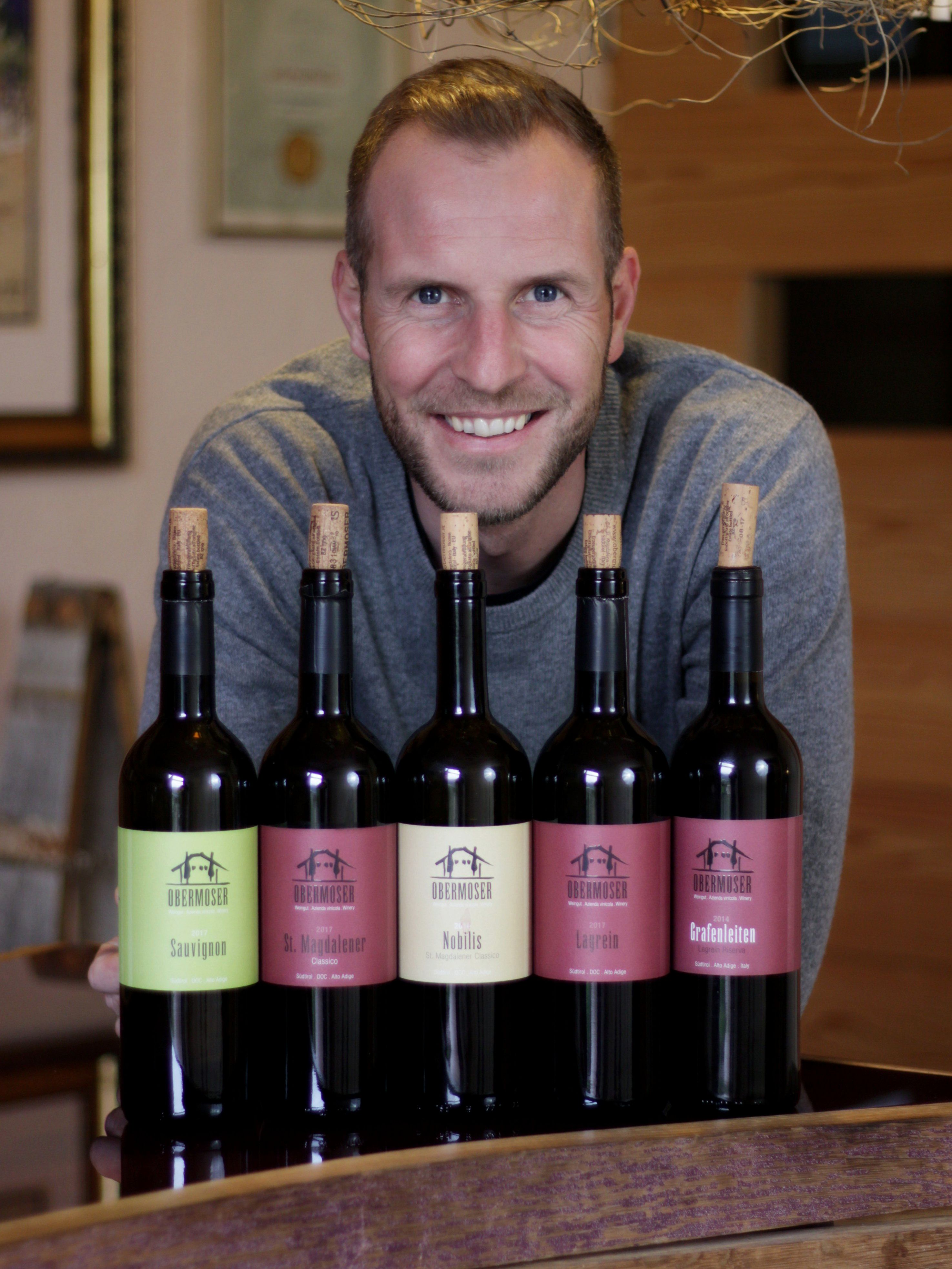 Thomas with wine bottles